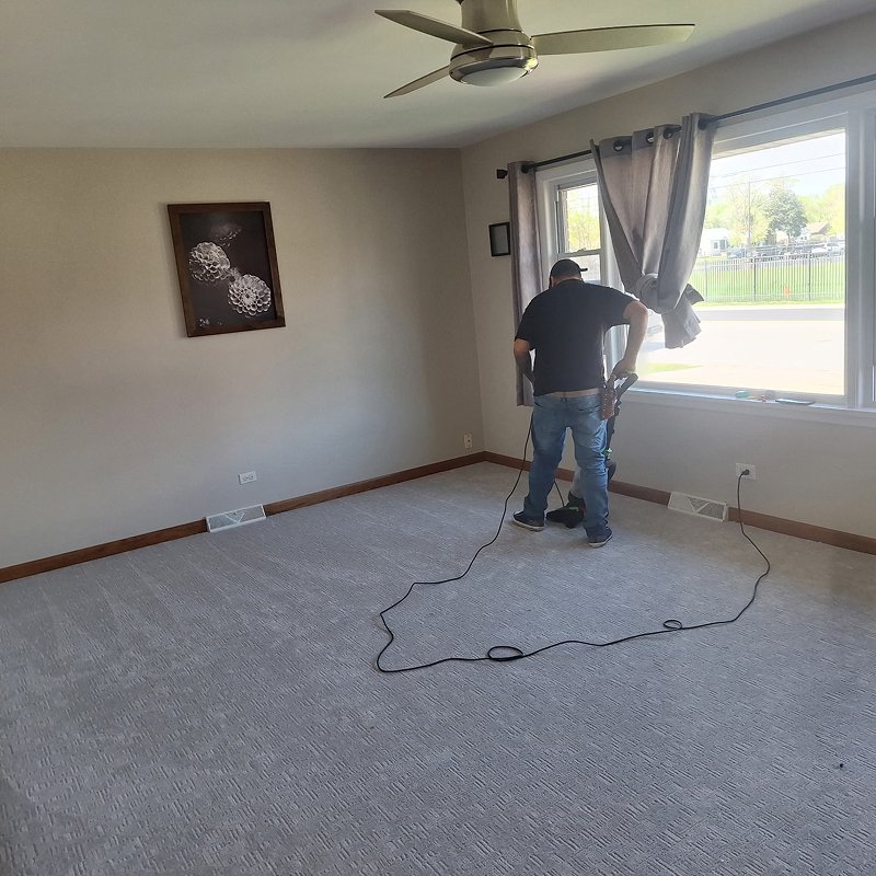 Vacuuming during a carpet install from Quality Carpets and Floors